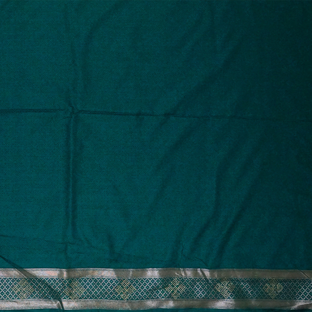 Rithvi Satin Teal blue color adorned with intricate golden zari embroidery