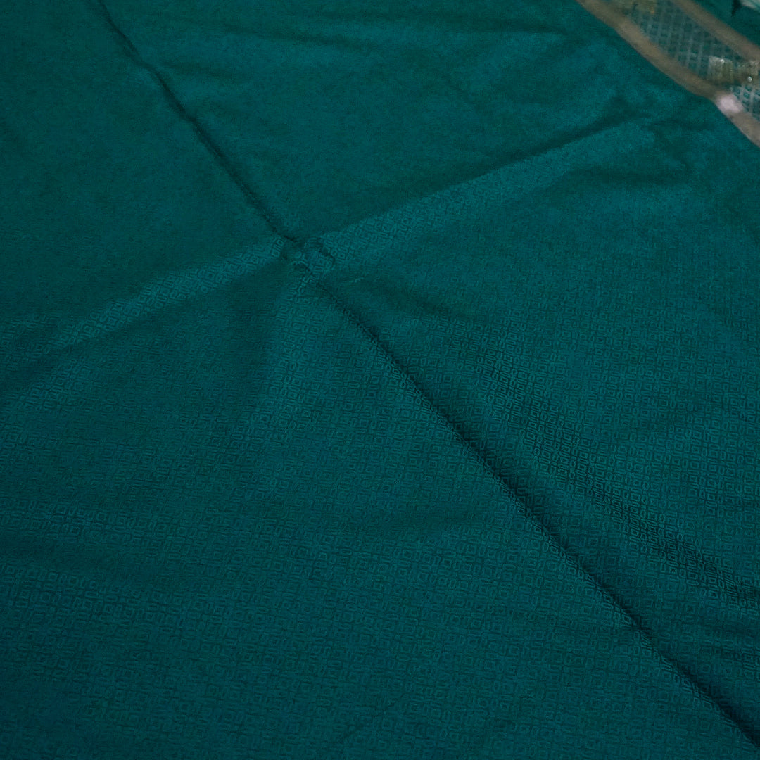 Rithvi Satin Teal blue color adorned with intricate golden zari embroidery