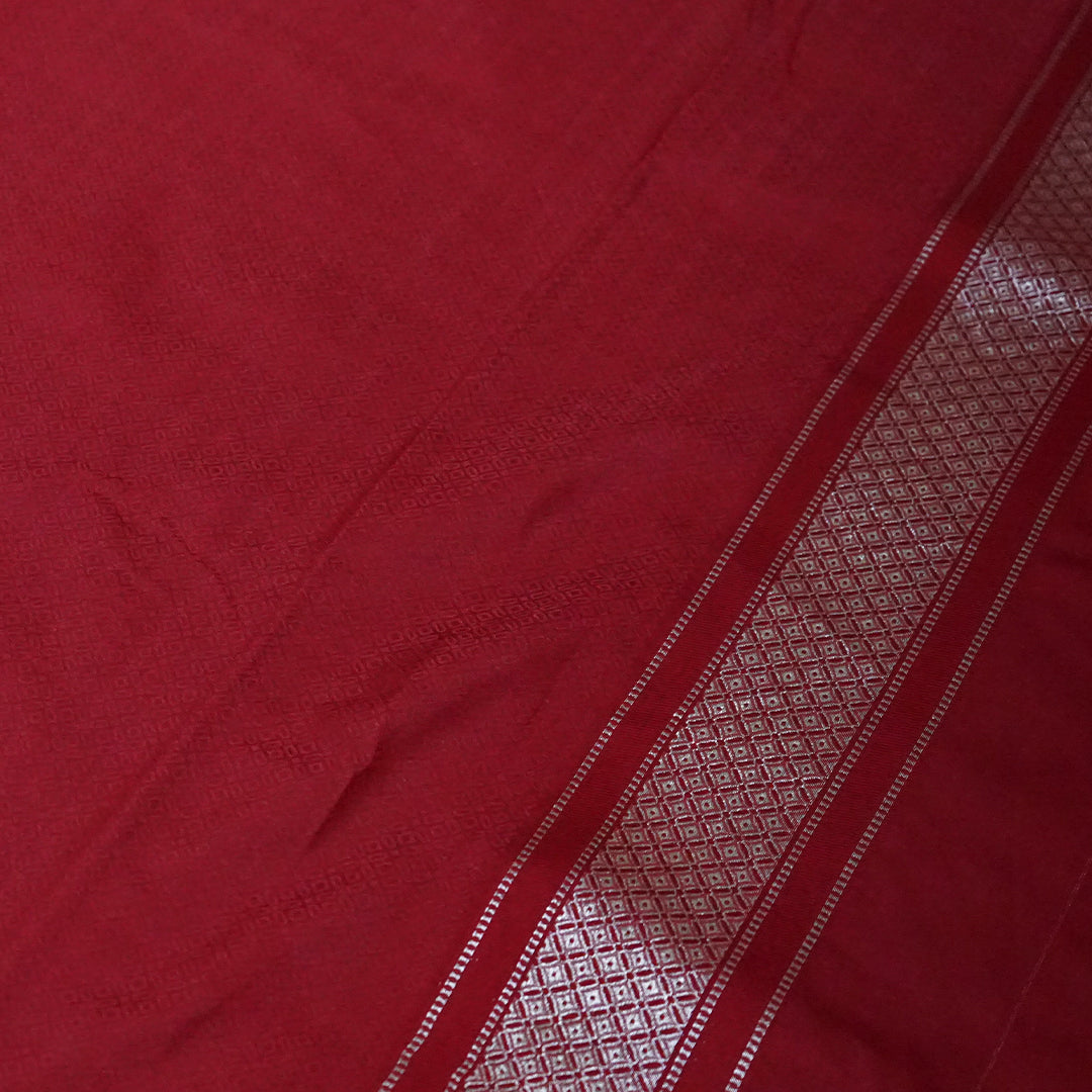 Rithvi Satin Deep red color adorned with intricate golden zari embroidery
