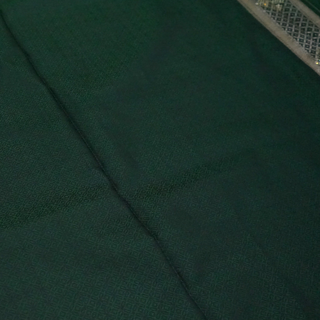 Rithvi Satin Emerald-green shade color adorned with intricate golden zari embroidery