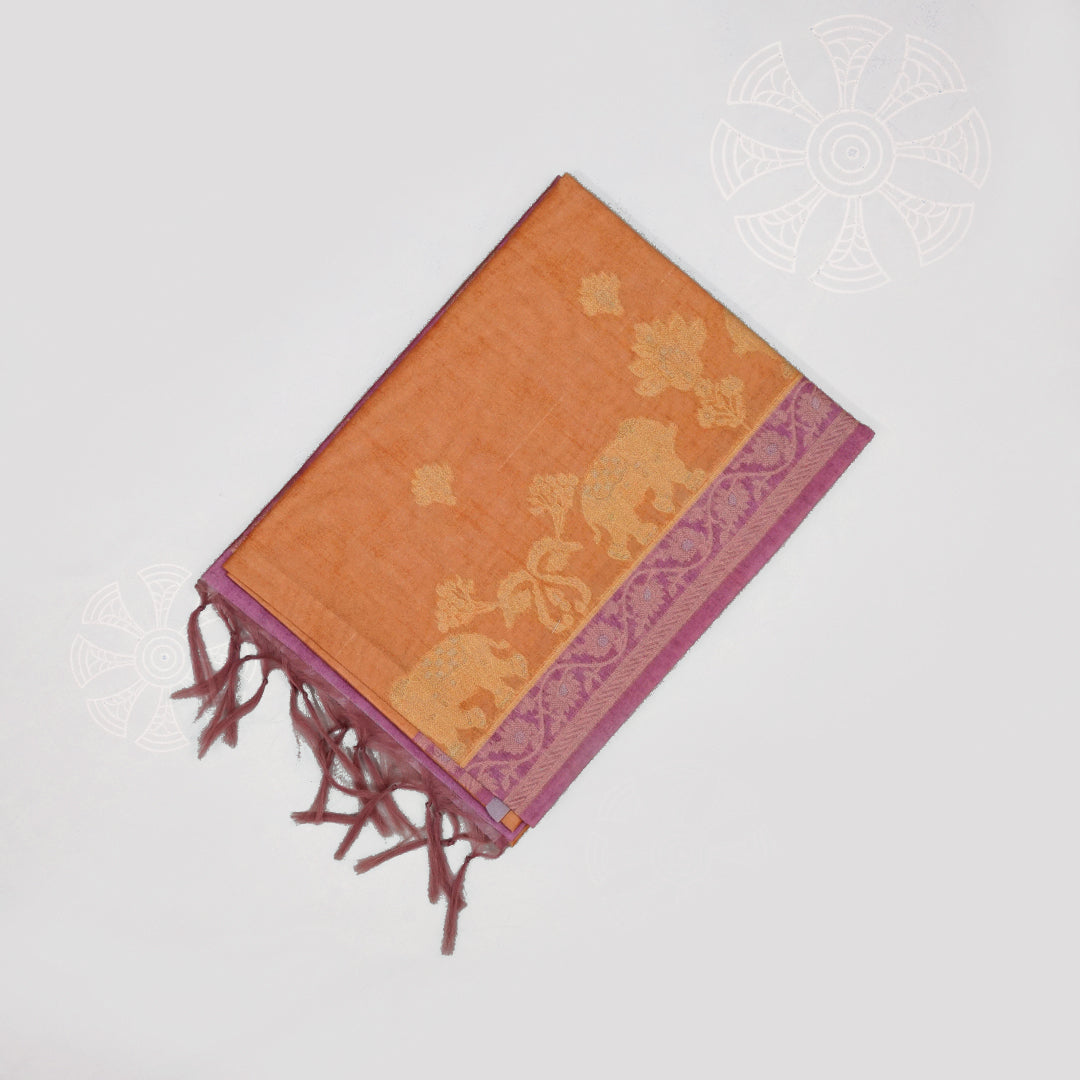 Golden Amber Ambari Silk Tussar with Dusky Mauve border and Zari works.
