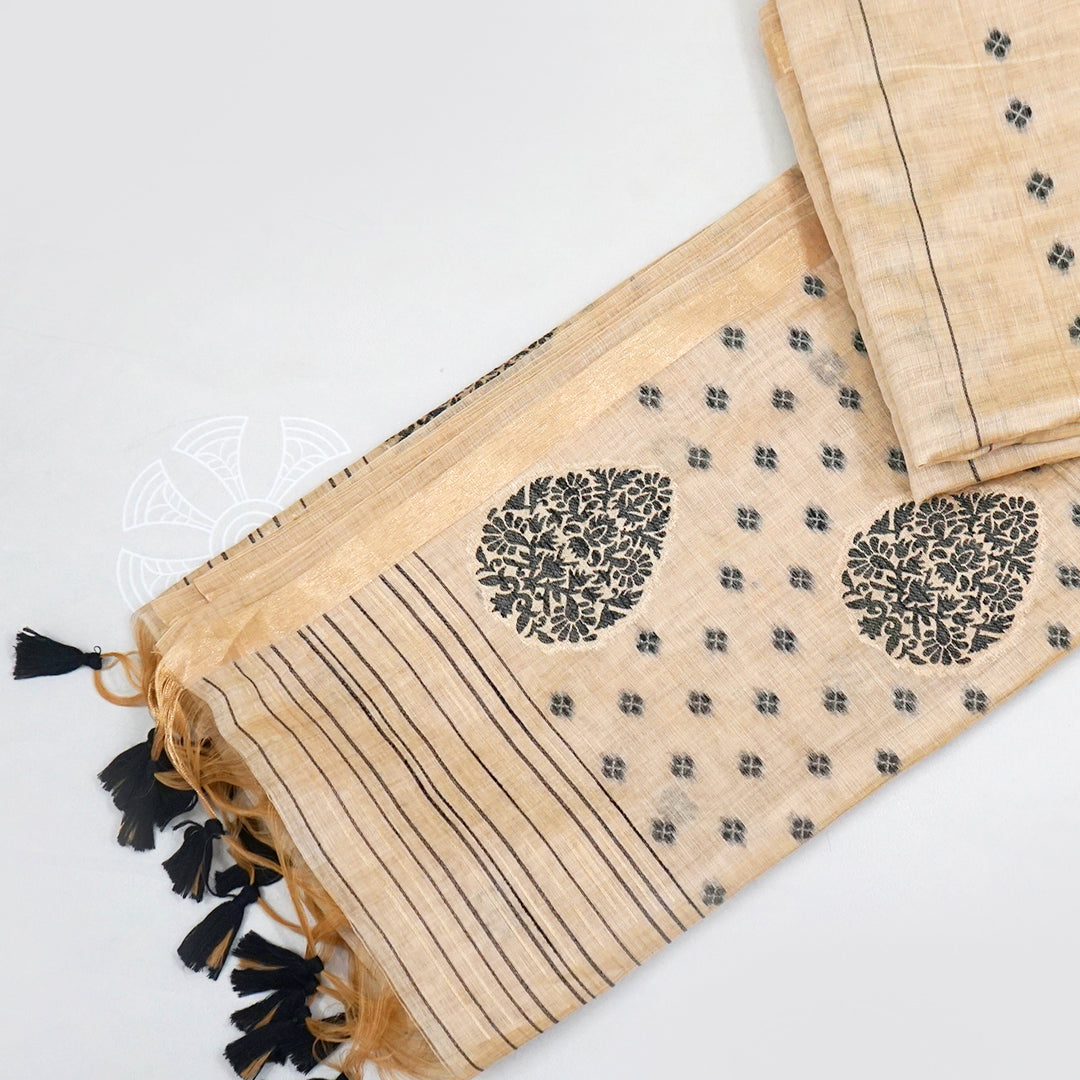 Beige Ishvani Tussar saree with black tassels