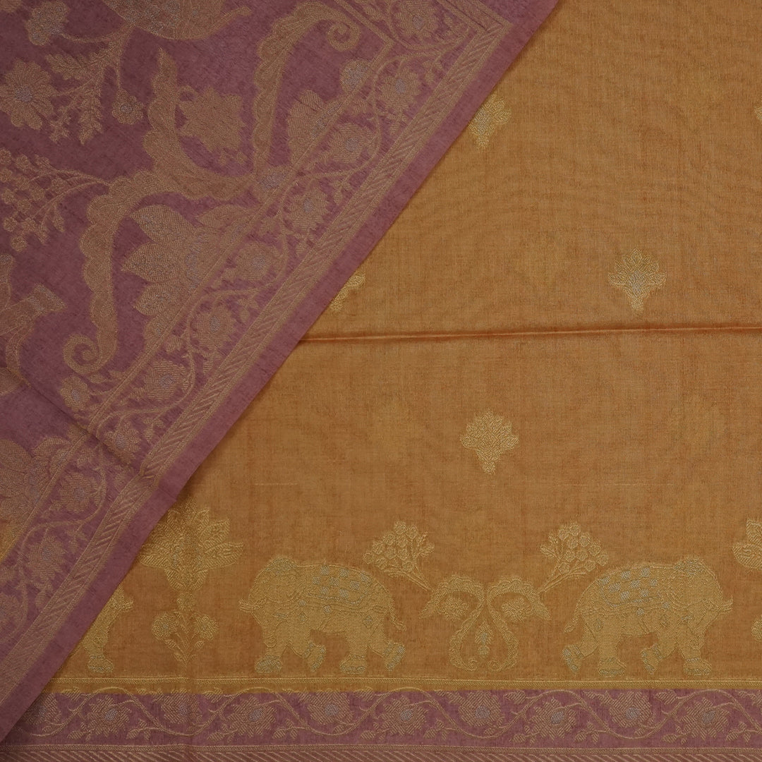Golden Amber Ambari Silk Tussar with Dusky Mauve border and Zari works.
