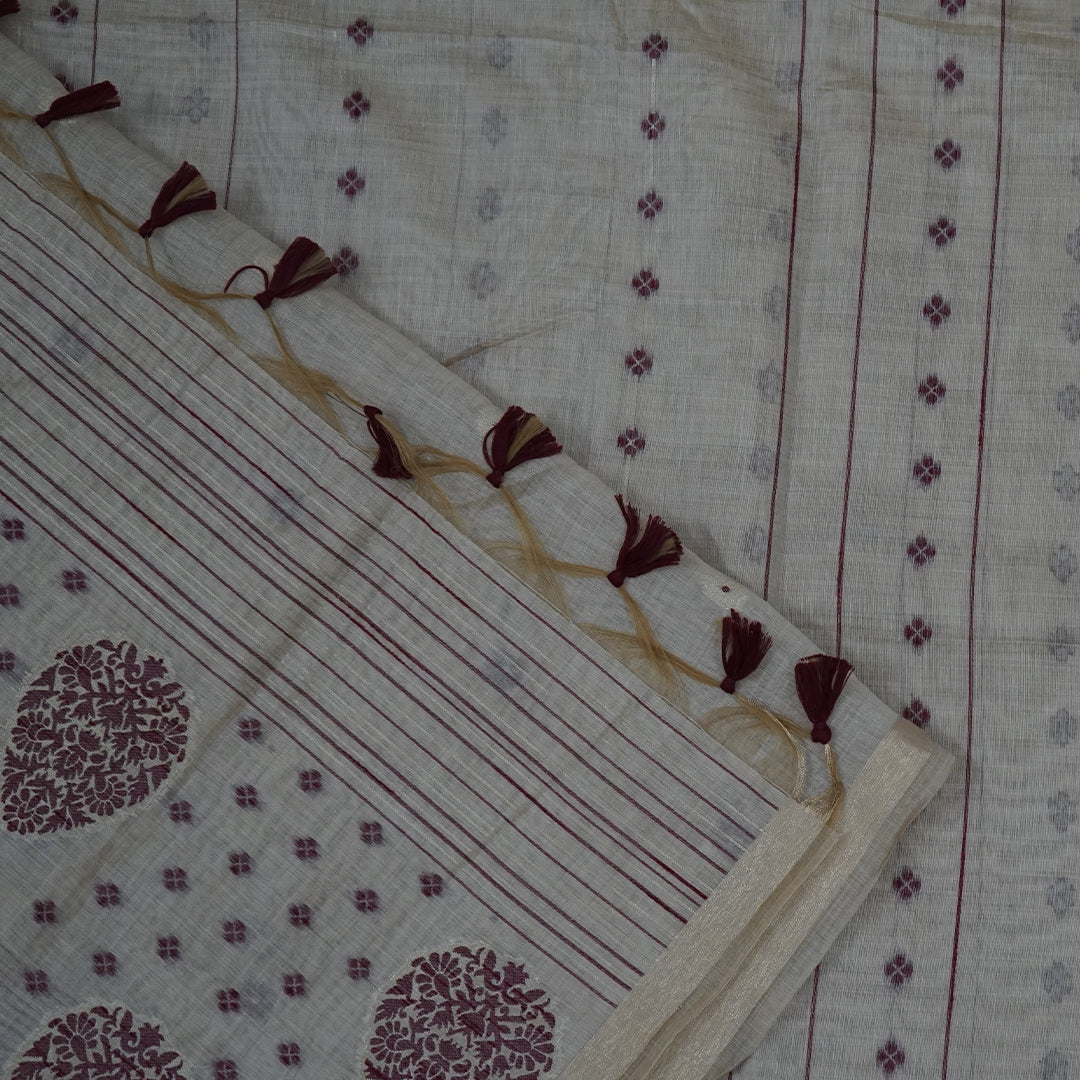 Beige Ishvani Tussar saree with Maroon tassels