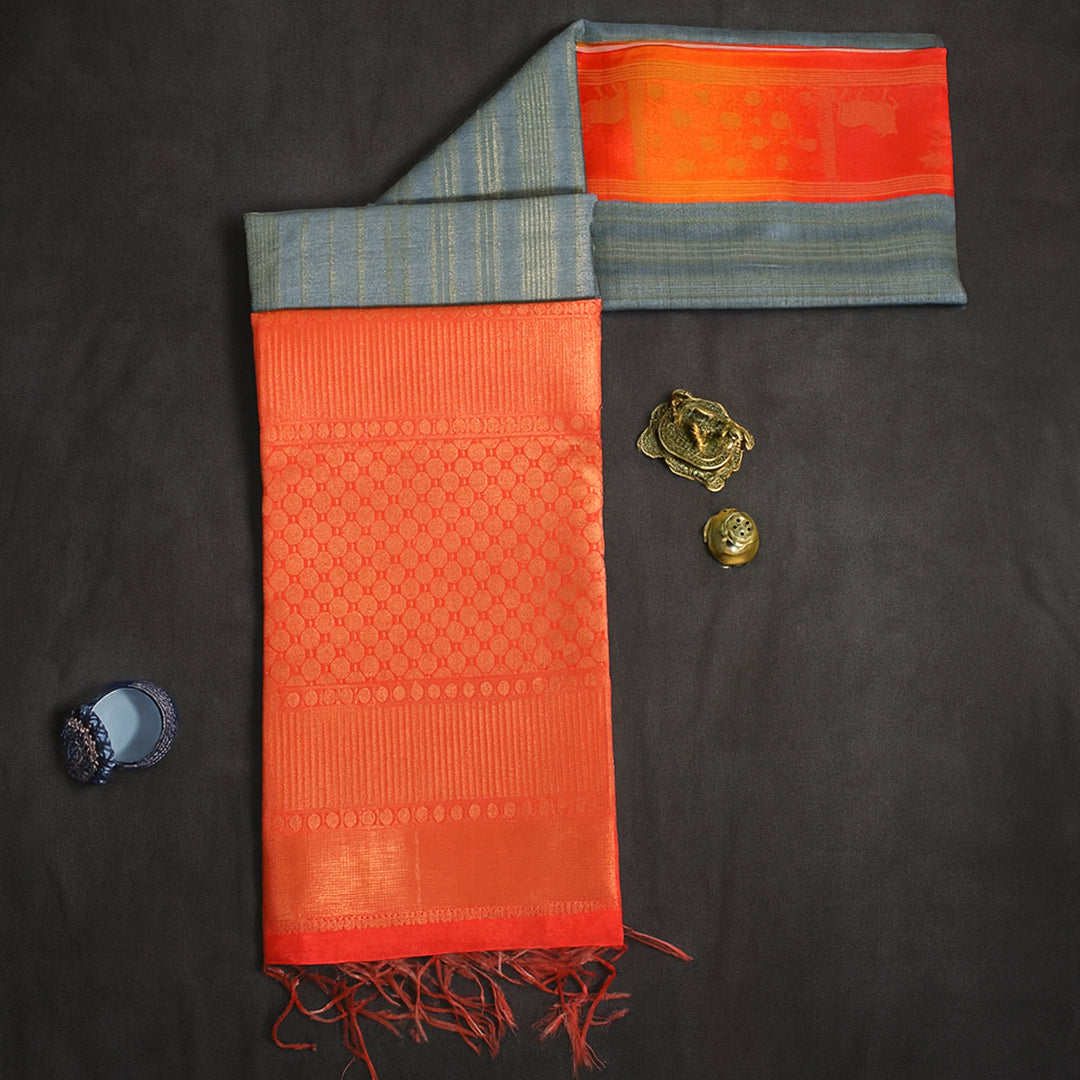 Subtle Grey Gokul Tussar with Red and Orange border.