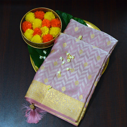 Vedika Silk saree in soft pastel pink shade with a luxurious golden zari weave.