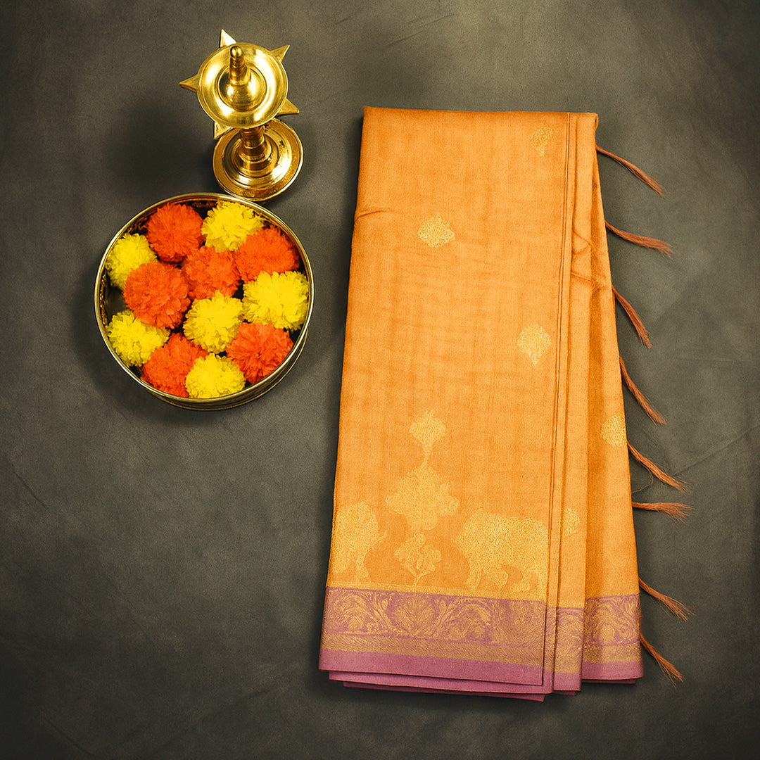 Golden Amber Ambari Silk Saree with Dusky Mauve border and Zari works.