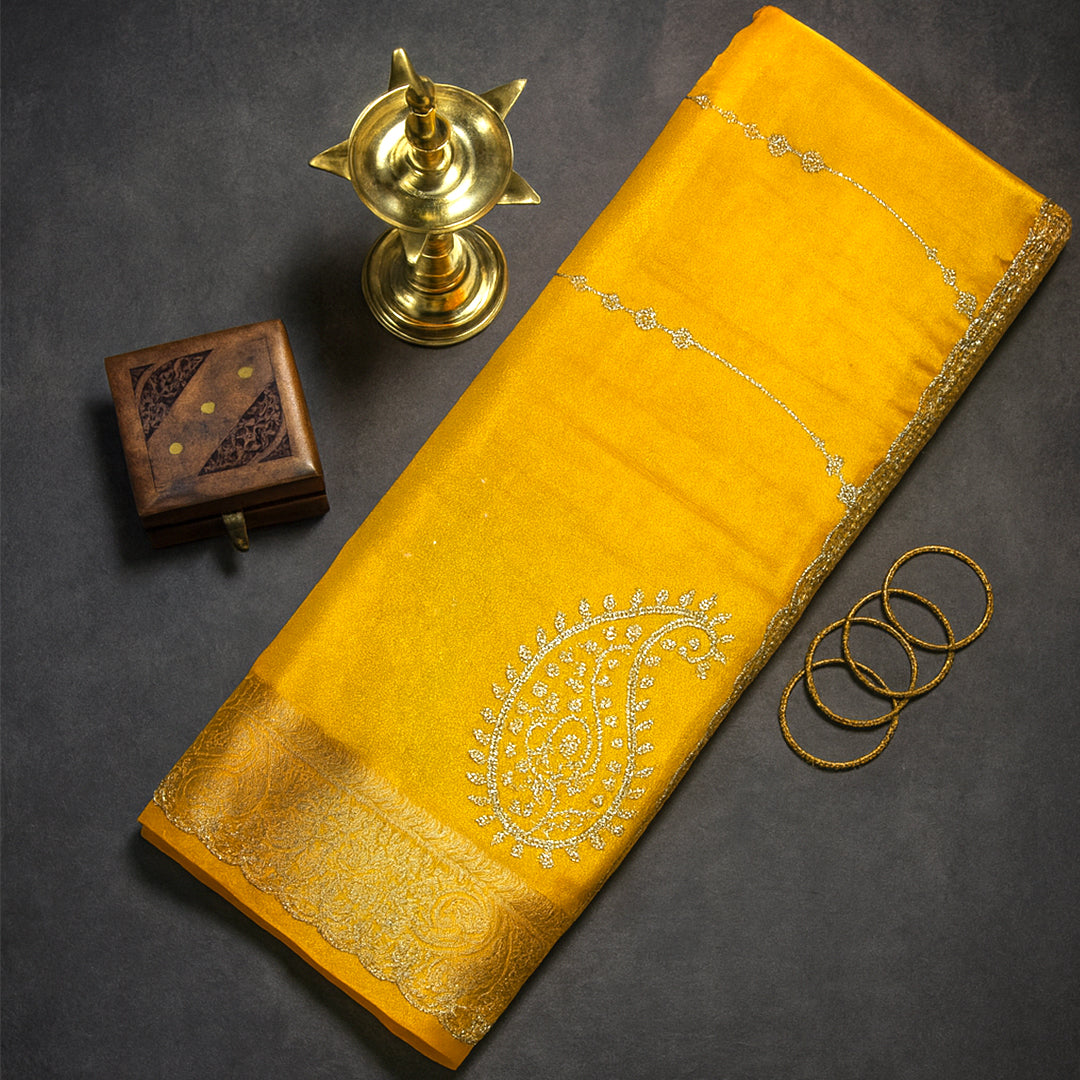 Ratnalekha Silk saree in rich golden yellow base highlighted with intricate silver zari embroidery