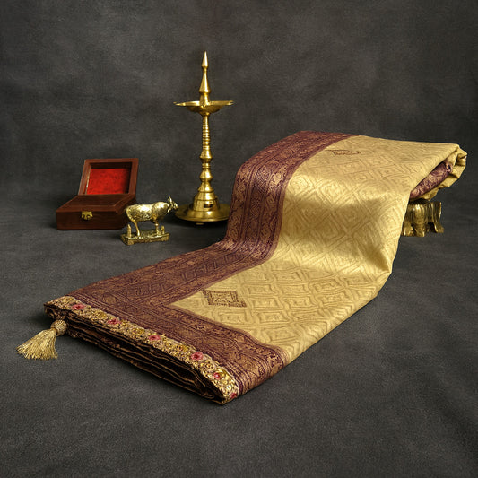 Golden cream Raj Virasat Silk saree with Deep purple base and heavy embroidery.