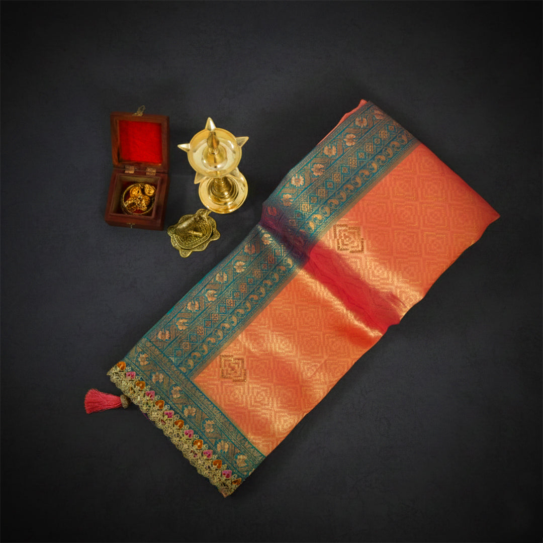 Peach-orange Raj Virasat Silk saree with Deep purple base and heavy embroidery.