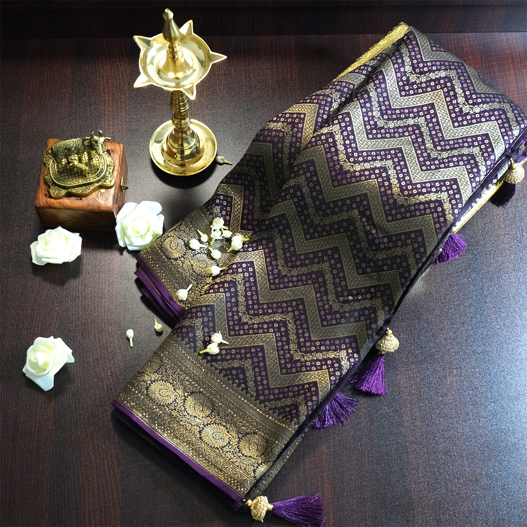 Tarani Silk saree in royal deep purple shade with a rich golden zari weave.