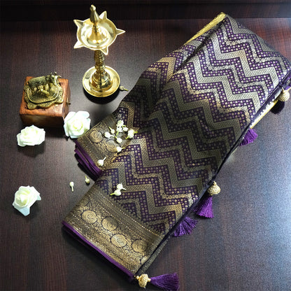 Tarani Silk saree in royal deep purple shade with a rich golden zari weave.