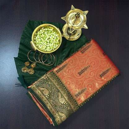 Madhur Bela rich coral-orange shade with a golden undertone.