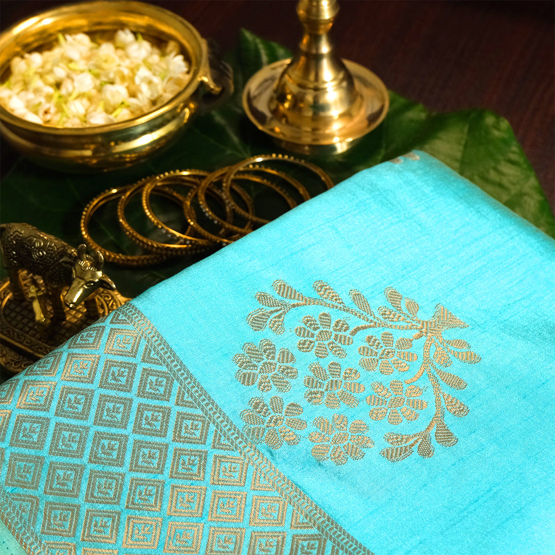 Chandhrika in Aqua Blue base with floral works