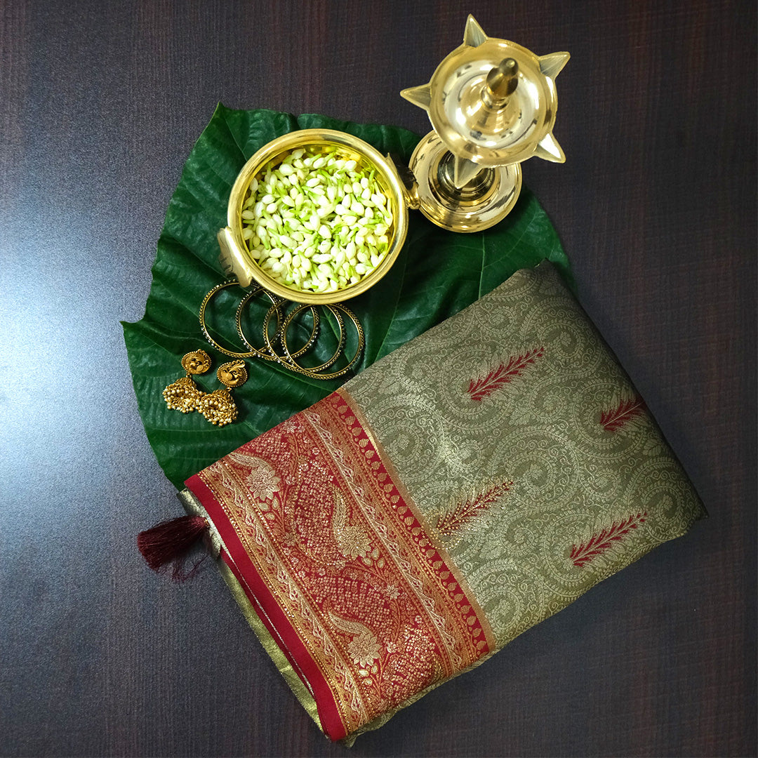 Madhur Bela Muted olive green shade with an elegant golden sheen