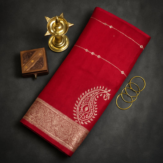 Ratnalekha silk saree in vibrant deep red base accentuated with intricate gold zari embroidery,