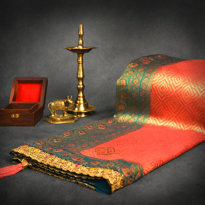 Peach-orange Raj Virasat Silk saree with Deep purple base and heavy embroidery.