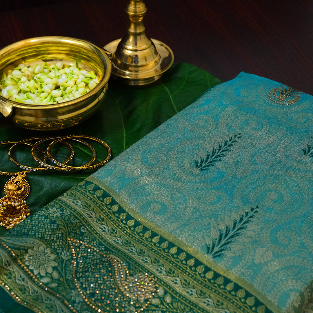 Madhur Bela soothing teal-green hue shade with a golden undertone.