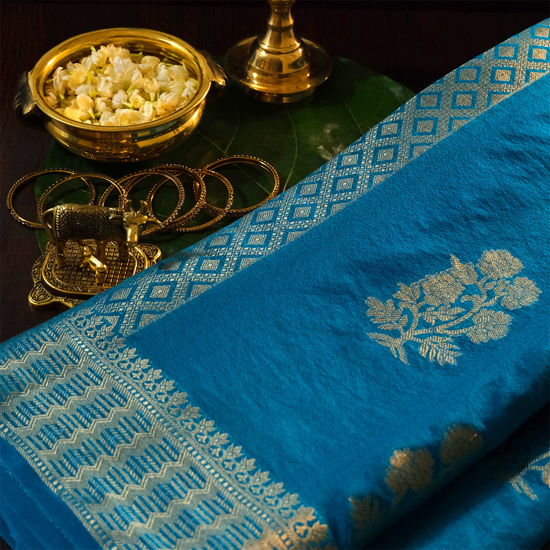 Neera Silk Saree in Vibrant Turquoise Blue with Floral works