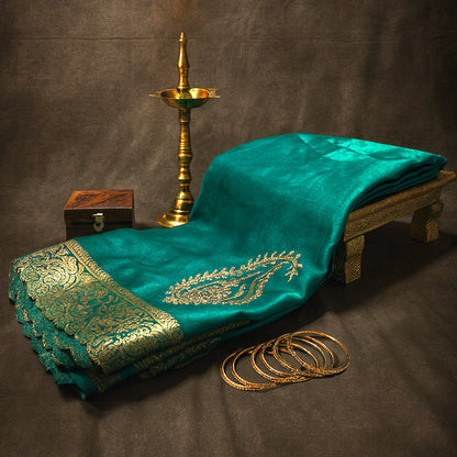 Ratnalekha Silk saree in rich emerald-green base accentuated with intricate gold zari work