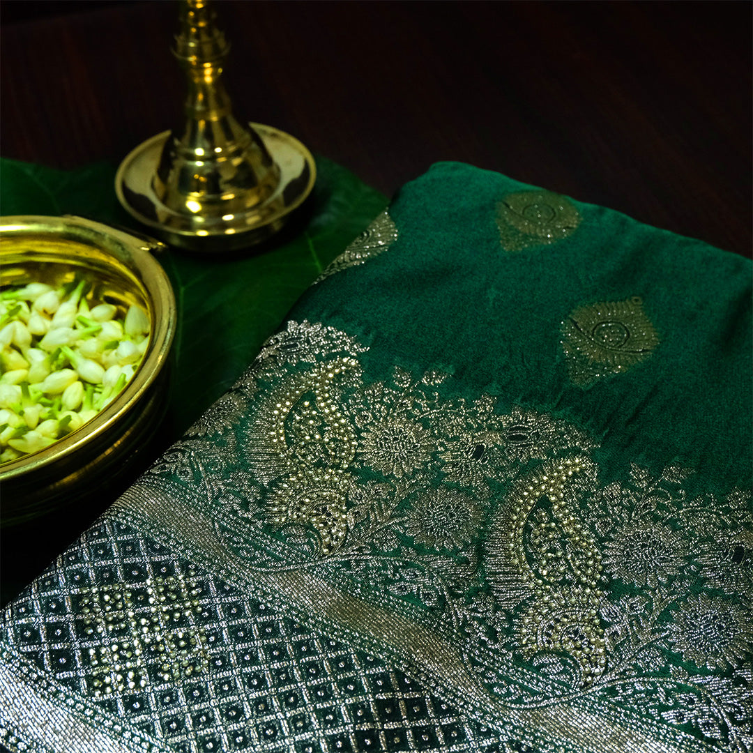 Rithvi Satin Emerald-green shade color adorned with intricate golden zari embroidery