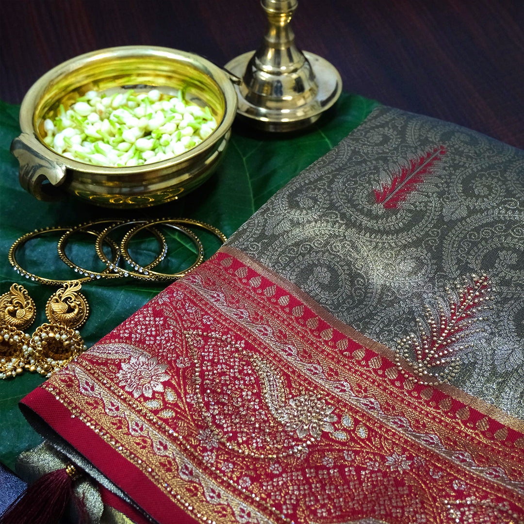 Madhur Bela Muted olive green shade with an elegant golden sheen