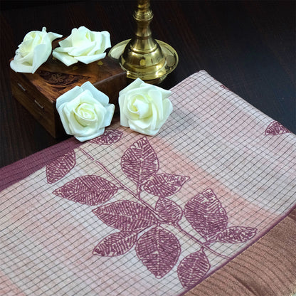 Harini Tussar in soft beige base with maroon leaf motifs and a matching brownish-maroon border, creating an elegant and earthy look.