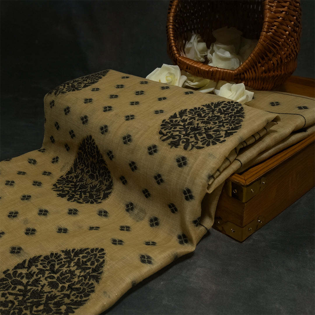 Beige Ishvani Tussar saree with black tassels