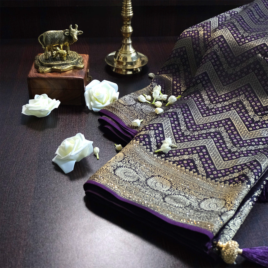 Tarani Silk saree in royal deep purple shade with a rich golden zari weave.