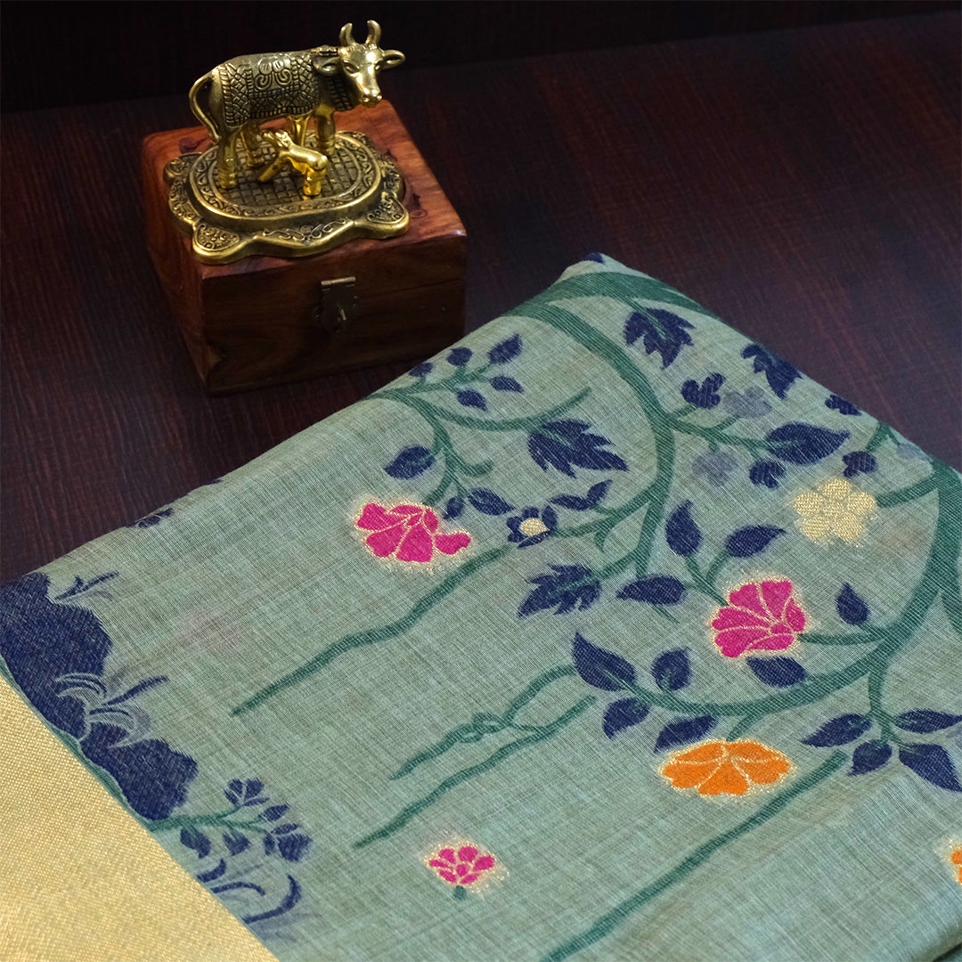 Varnica Tussar Soft pastel green shade with a subtle golden shimmer