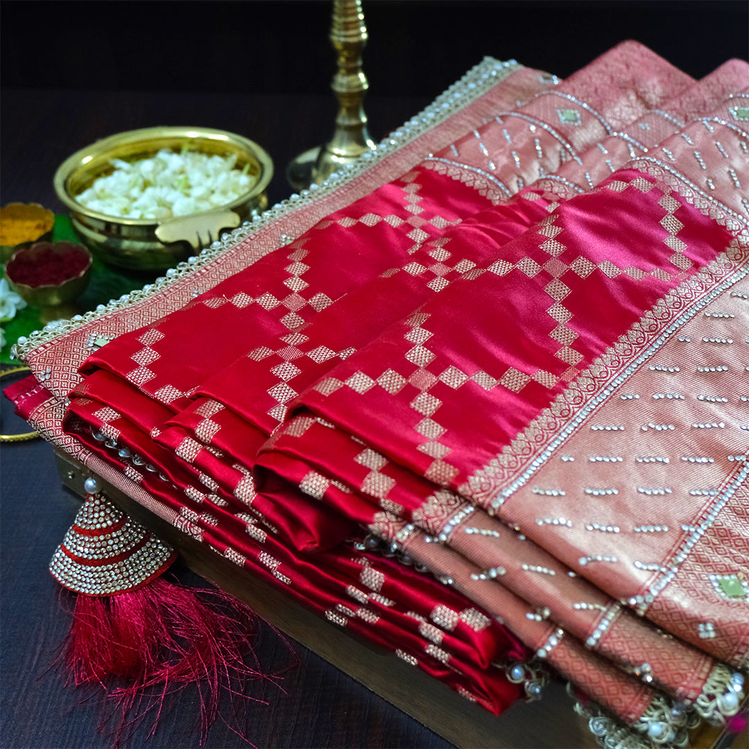 Samrudhi Silk saree in vibrant crimson red with a shimmering copper-toned border.