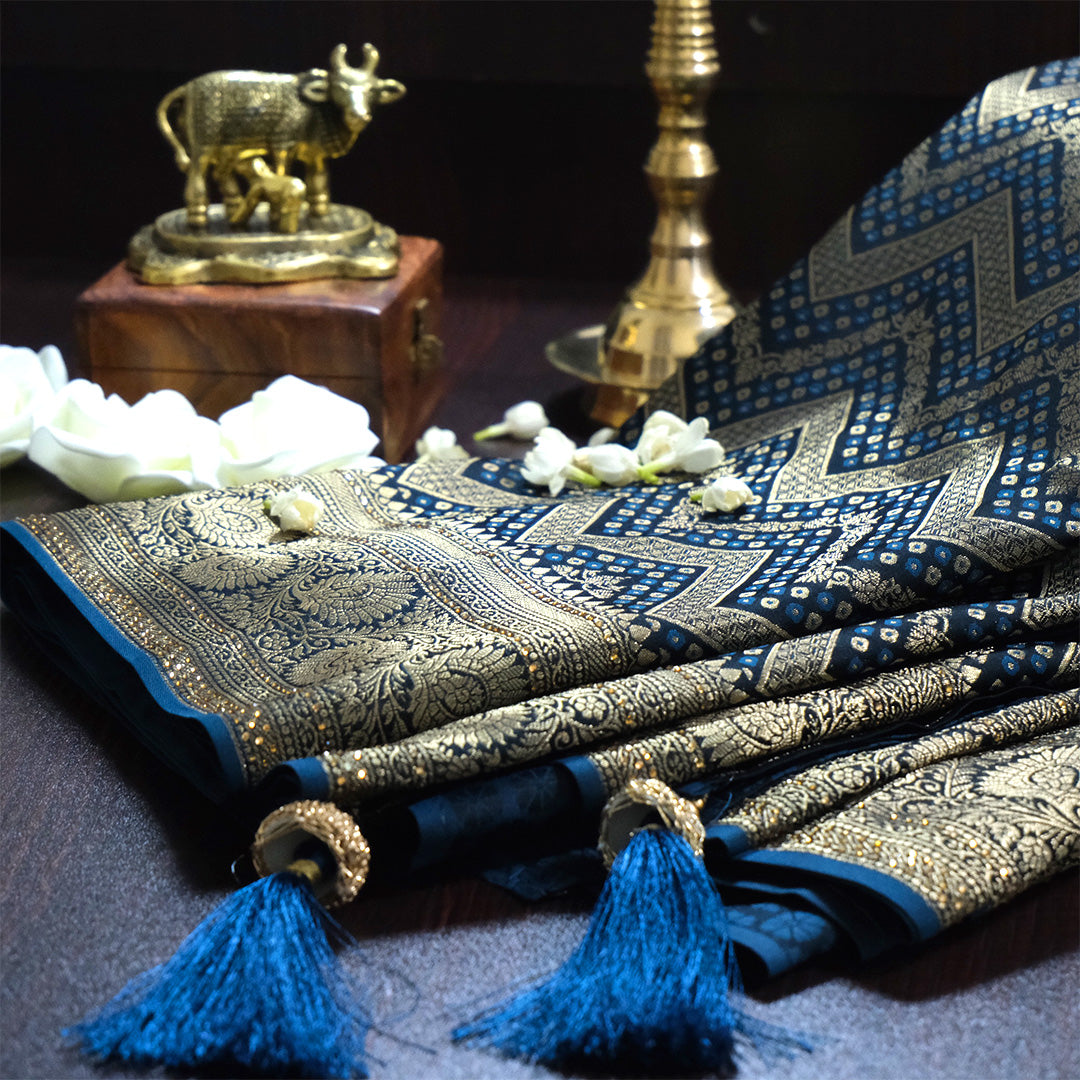 Tarani Silk saree in deep navy blue shade with a rich golden zari weave.