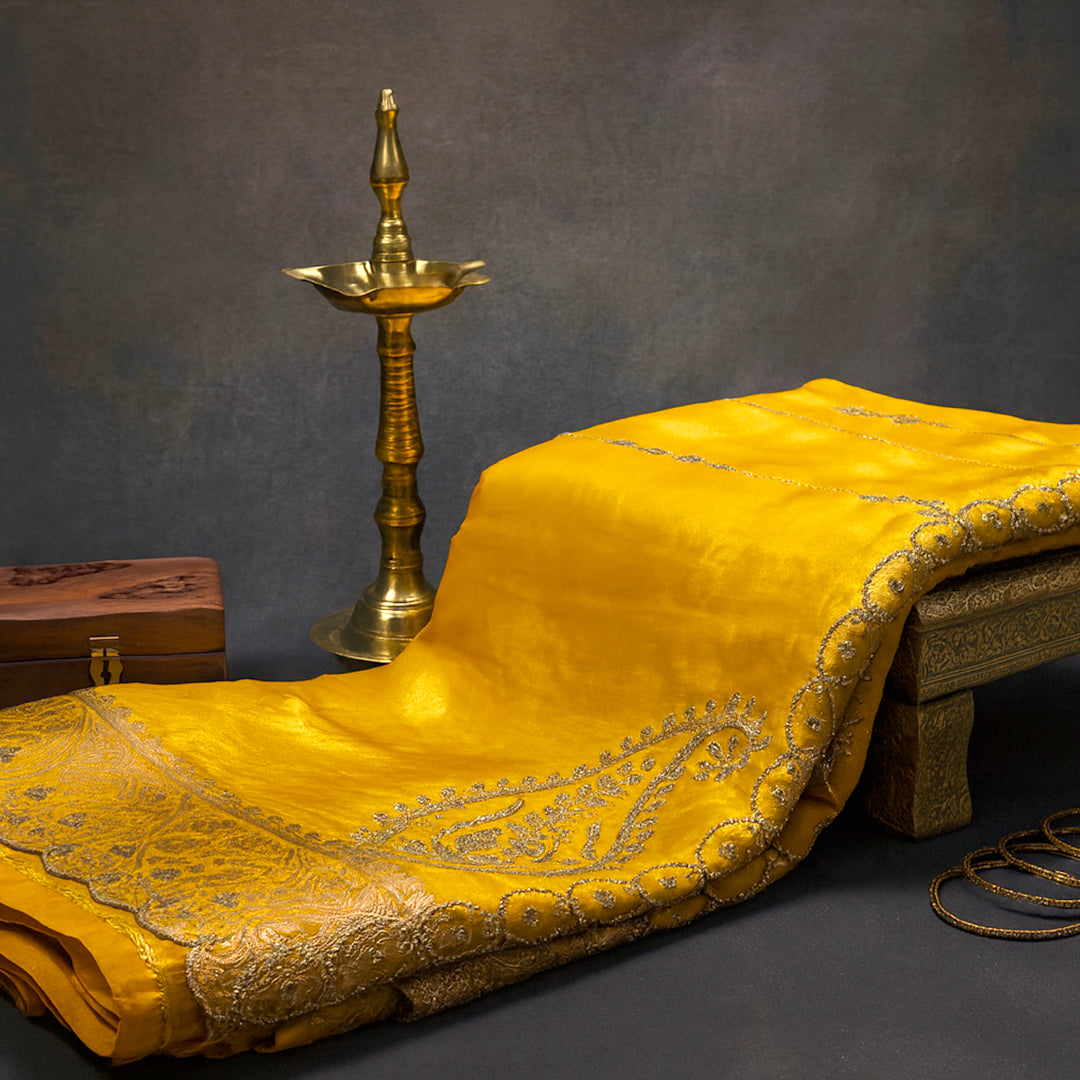 Ratnalekha Silk saree in rich golden yellow base highlighted with intricate silver zari embroidery