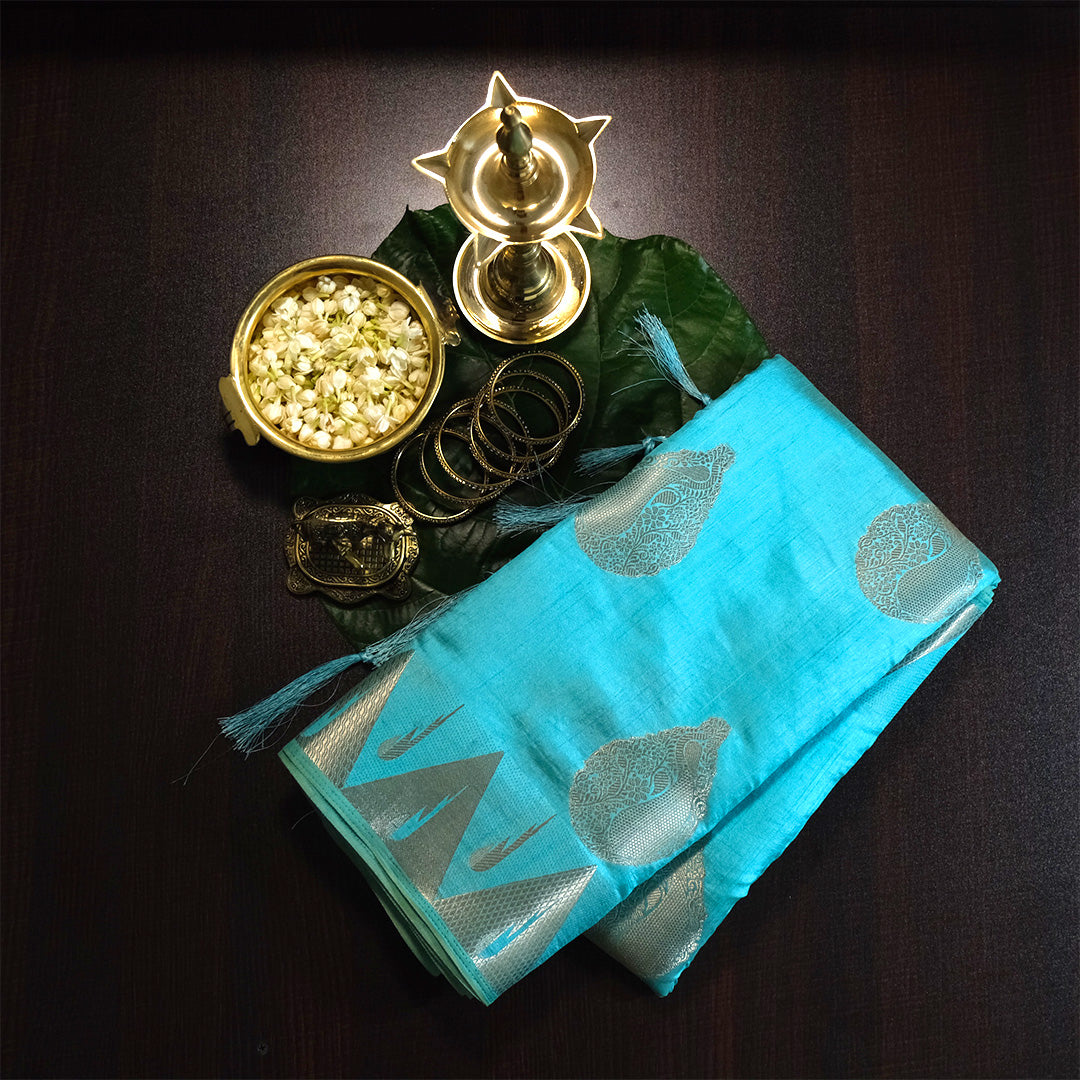 Chandhrika in Aqua Blue base with floral works