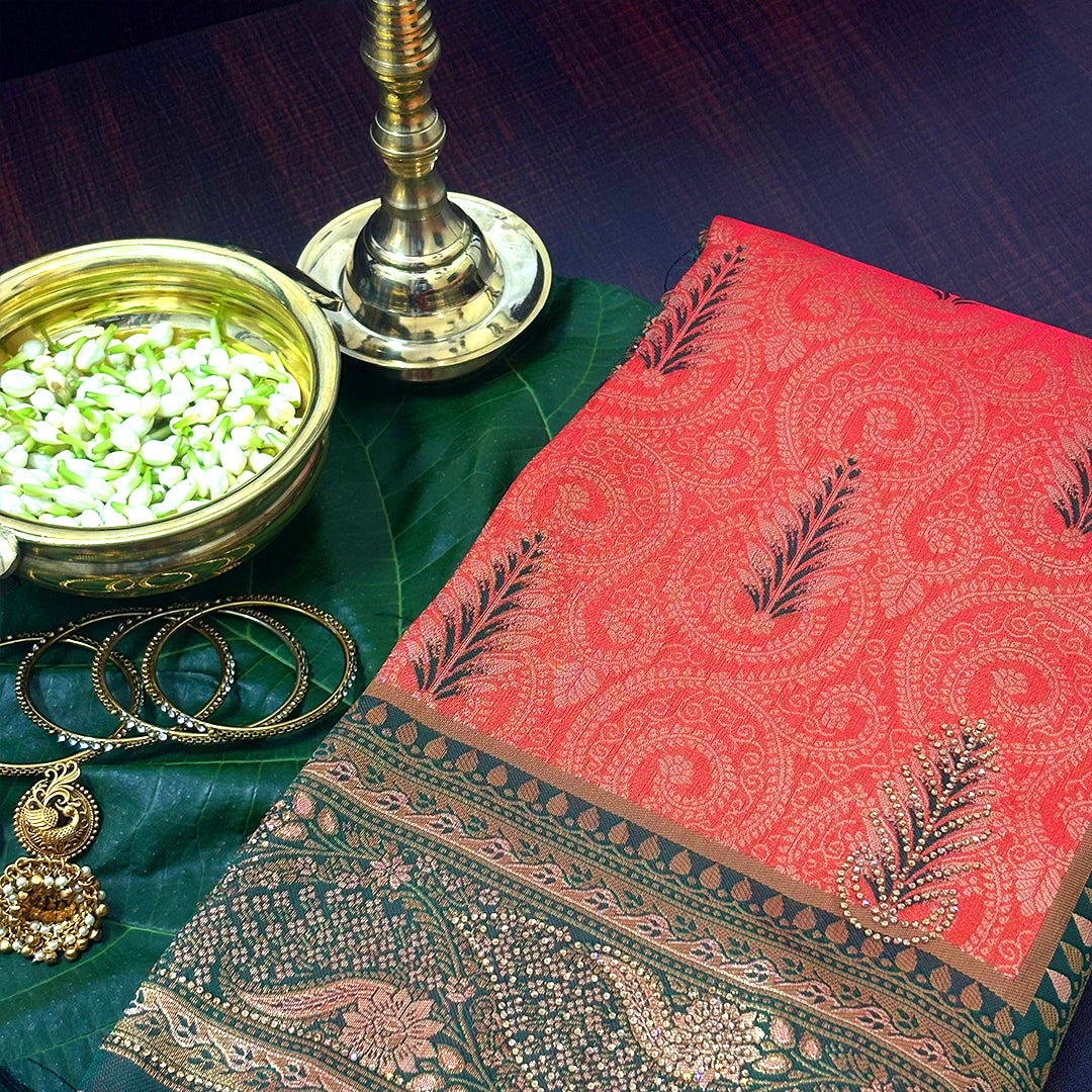 Madhur Bela rich coral-orange shade with a golden undertone.