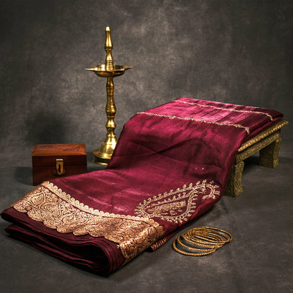 Ratnalekha Silk saree in rich wine-maroon base adorned with intricate gold zari embroidery
