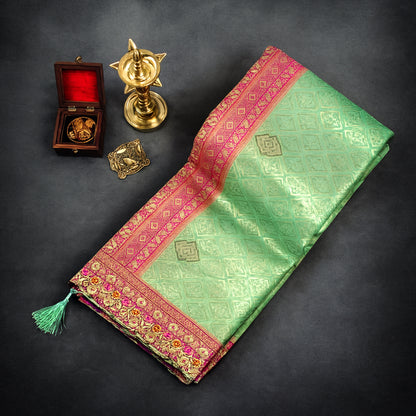 Mint Green Raj Virasat Silk saree with Deep purple base and heavy embroidery.