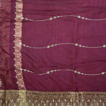 Ratnalekha Silk saree in rich wine-maroon base adorned with intricate gold zari embroidery