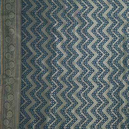 Tarani Silk saree in deep navy blue shade with a rich golden zari weave.