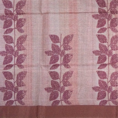 Harini Tussar in soft beige base with maroon leaf motifs and a matching brownish-maroon border, creating an elegant and earthy look.
