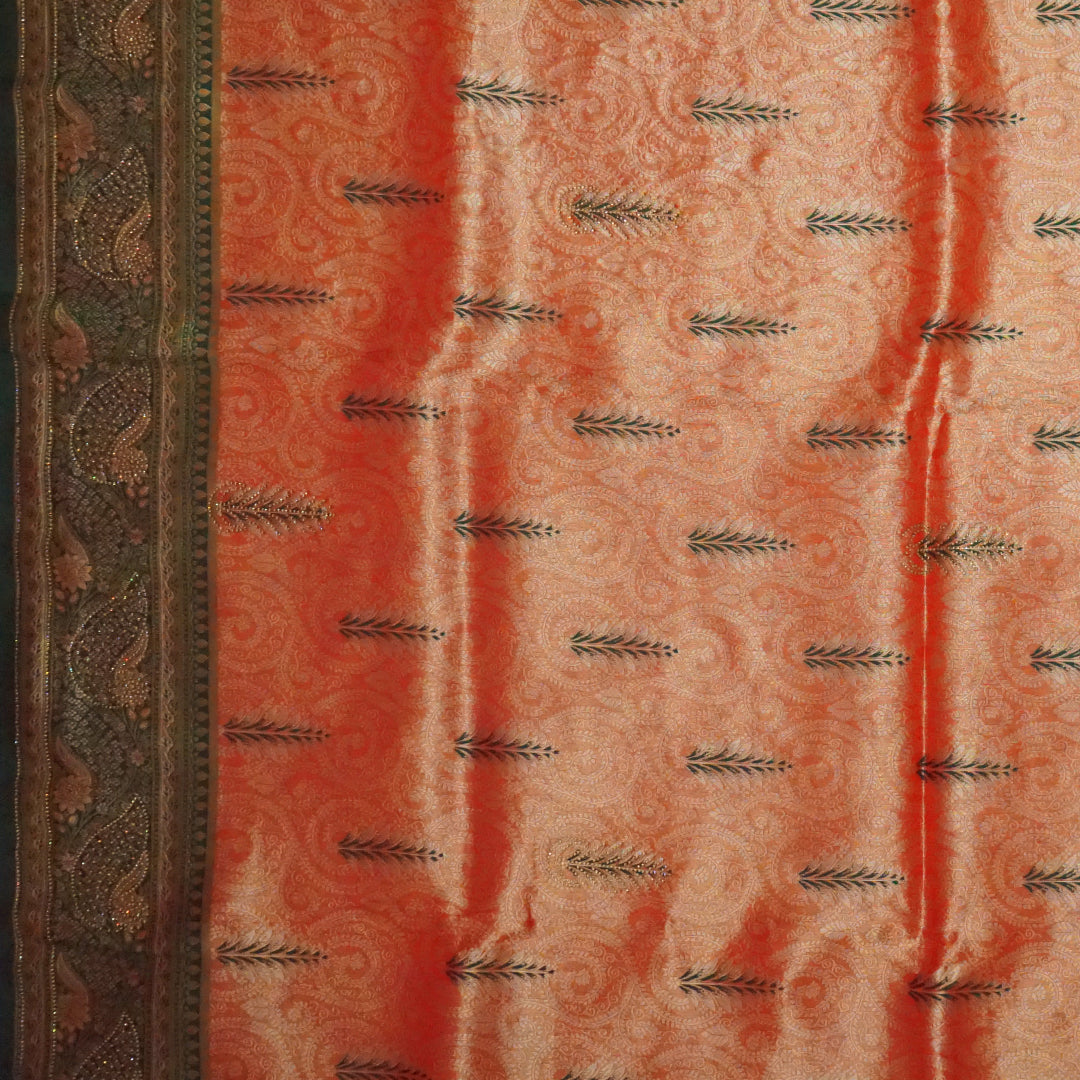 Madhur Bela rich coral-orange shade with a golden undertone.