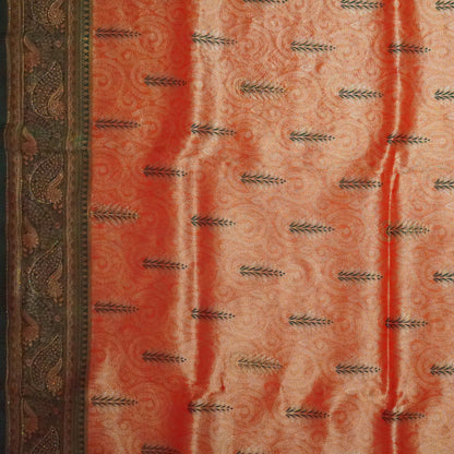 Madhur Bela rich coral-orange shade with a golden undertone.