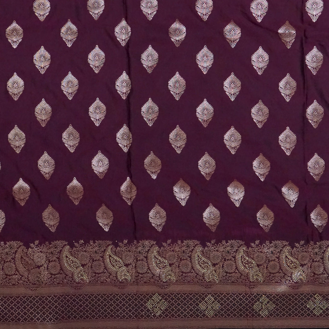 Rithvi Satin Deep plum shade color adorned with intricate golden zari embroidery
