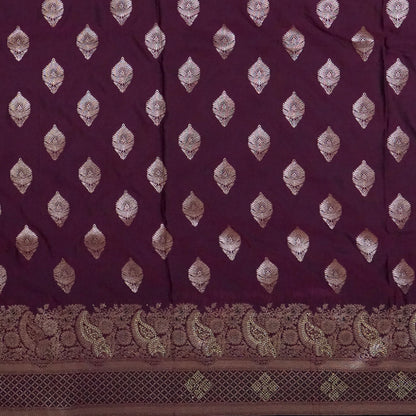 Rithvi Satin Deep plum shade color adorned with intricate golden zari embroidery