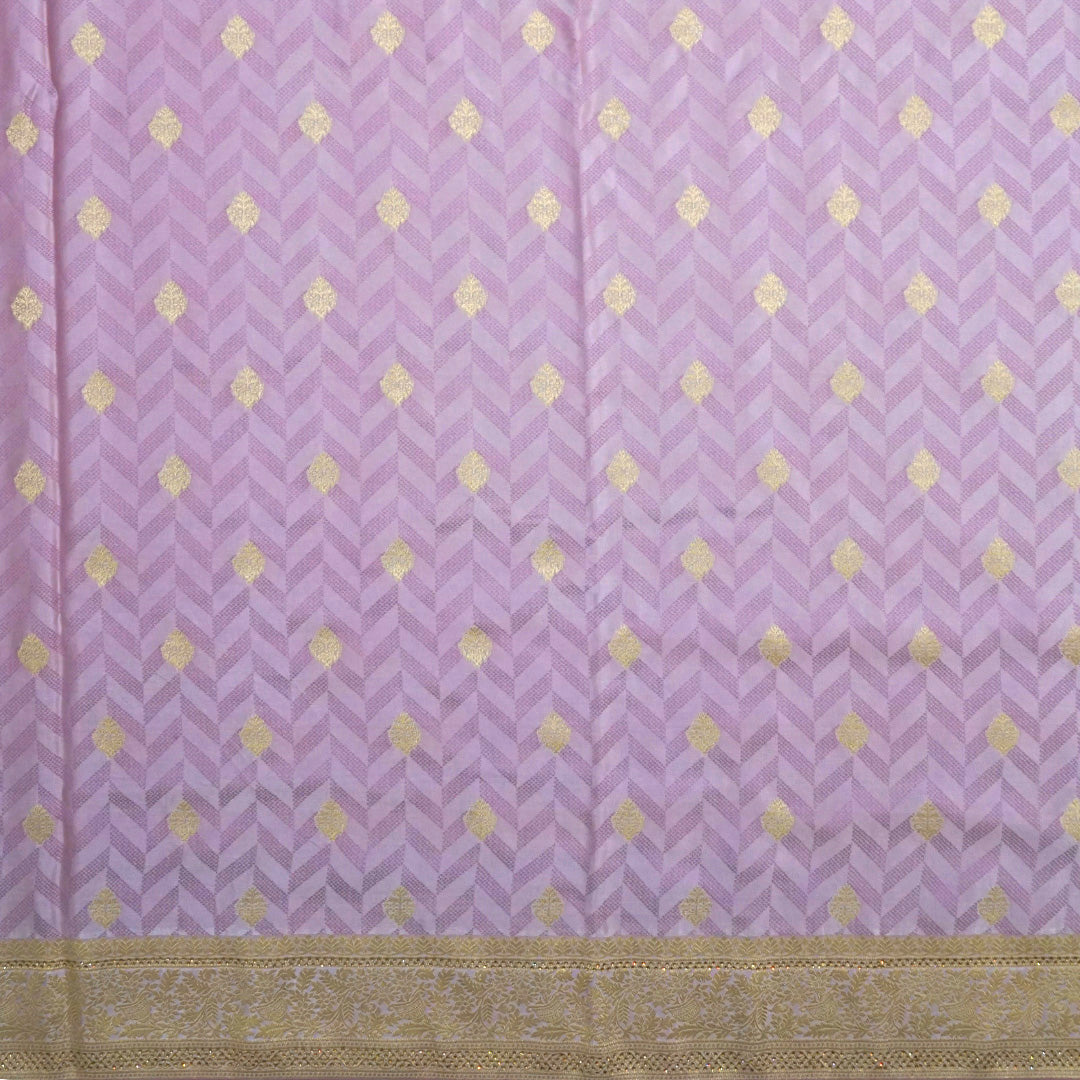 Vedika Silk saree in soft pastel pink shade with a luxurious golden zari weave.