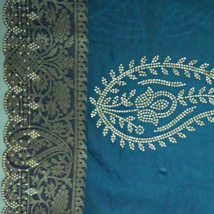 Ratnalekha silk saree in rich teal-blue base adorned with intricate gold zari work,