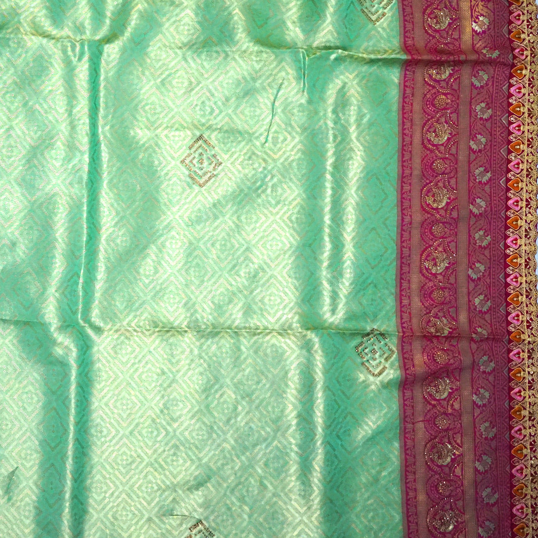 Mint Green Raj Virasat Silk saree with Deep purple base and heavy embroidery.