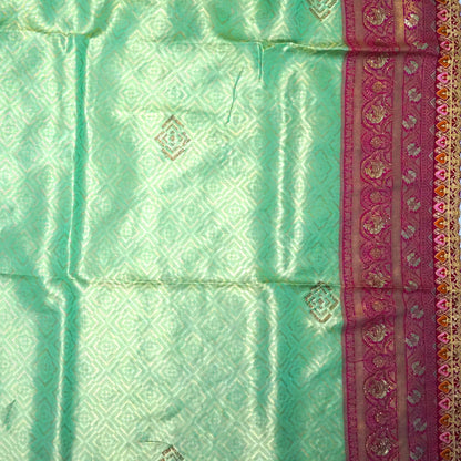 Mint Green Raj Virasat Silk saree with Deep purple base and heavy embroidery.