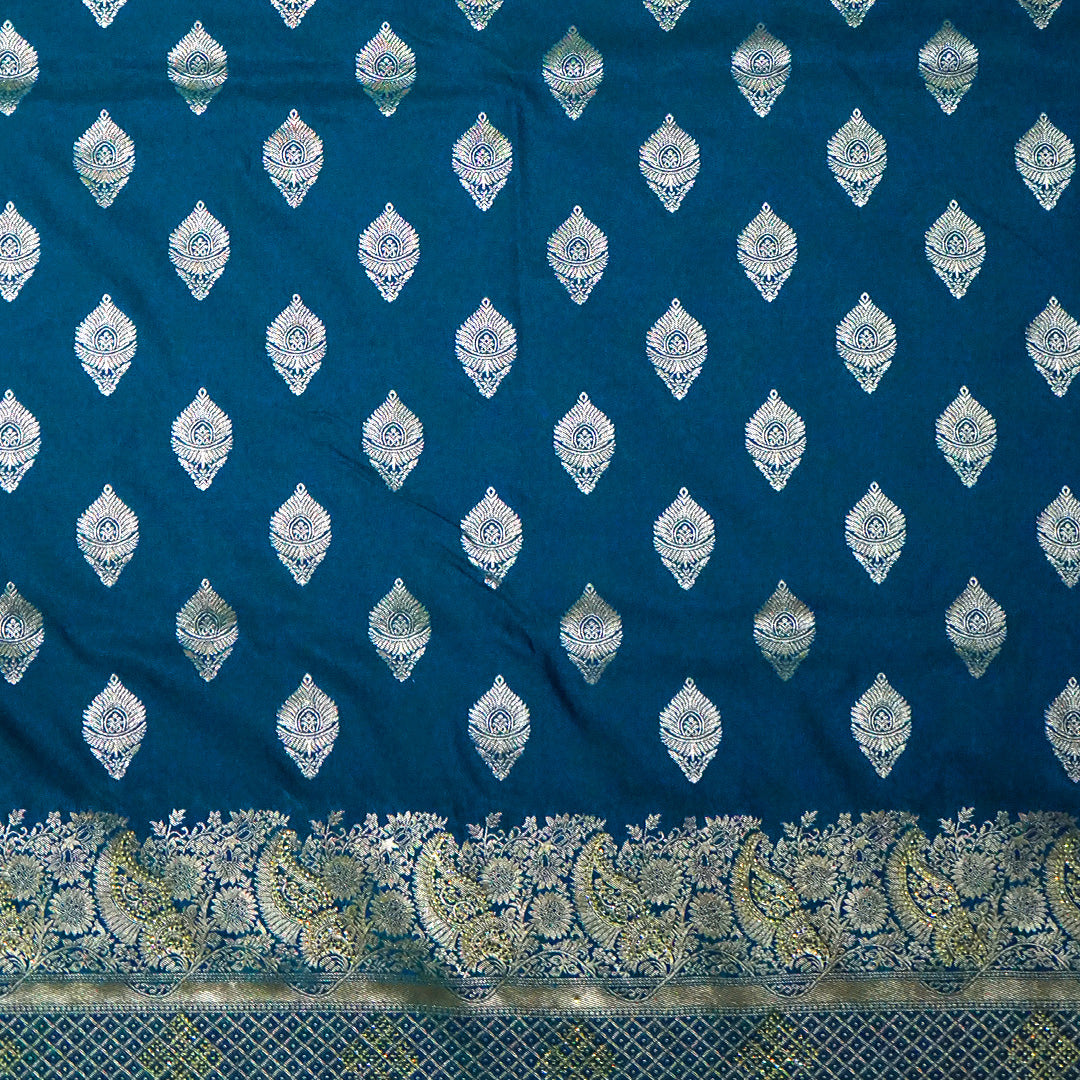 Rithvi Satin Aqua blue color adorned with intricate golden zari embroidery