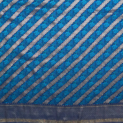 Megha Silk saree in rich royal blue with alternating metallic gold zari stripes.
